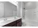 Bathroom featuring a double sink vanity and a shower-tub combo at 3868 E Robert St, Gilbert, AZ 85295