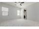 Spacious bedroom with neutral carpet and view into bathroom at 3868 E Robert St, Gilbert, AZ 85295