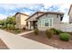 Attractive home with a covered front porch, tidy landscaping, and a pleasing color scheme at 3868 E Robert St, Gilbert, AZ 85295