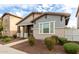 Lovely home featuring a covered entryway, neat landscaping, and a harmonious color palette at 3868 E Robert St, Gilbert, AZ 85295