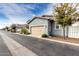 Home exterior showcasing attached garage, neutral trim and siding, landscaping, and street view at 3868 E Robert St, Gilbert, AZ 85295