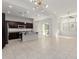 Large kitchen with granite island, stainless appliances, abundant natural light and view to the living area at 3868 E Robert St, Gilbert, AZ 85295