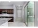 Modern kitchen with granite counters, stainless appliances, island and view to the hallway and patio at 3868 E Robert St, Gilbert, AZ 85295