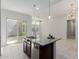 Spacious kitchen featuring a granite island with a sink and stainless steel dishwasher at 3868 E Robert St, Gilbert, AZ 85295