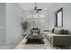 Bright living room with neutral tones, large windows, comfortable seating, and stylish decor at 3868 E Robert St, Gilbert, AZ 85295
