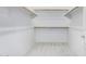 Walk-in closet with plush carpet, wood shelving, and white walls at 3868 E Robert St, Gilbert, AZ 85295