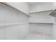 Walk-in closet with carpeted floor and wood shelving at 3868 E Robert St, Gilbert, AZ 85295