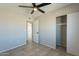 Cozy bedroom featuring an open closet and a ceiling fan for year-round comfort at 3905 N San Carlos Dr, Eloy, AZ 85131