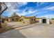 A view of the rear exterior of the home showing the backyard and detached garage at 418 E 3Rd St, Casa Grande, AZ 85122