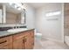 Bathroom with decorative tile accents, framed mirror, and ample vanity storage at 4253 N Plaza Dr, Apache Junction, AZ 85120