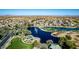 Beautiful aerial view of lake with fountains, golf course, and homes in a well maintained community at 42735 W Bravo Dr, Maricopa, AZ 85138