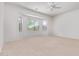 Spacious bedroom with bay window and neutral carpet at 42735 W Bravo Dr, Maricopa, AZ 85138