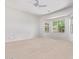 Large primary bedroom with a neutral color palette and ceiling fan at 42735 W Bravo Dr, Maricopa, AZ 85138