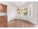 Bright breakfast nook has bay windows and decorative lighting at 42735 W Bravo Dr, Maricopa, AZ 85138