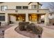 Home exterior with a stone walkway leading to a covered patio at 42735 W Bravo Dr, Maricopa, AZ 85138