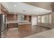 Bright kitchen with stainless steel appliances, center island, and ample counter space at 42735 W Bravo Dr, Maricopa, AZ 85138