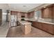 Spacious kitchen featuring a large island, stainless steel appliances, and ample cabinet space at 42735 W Bravo Dr, Maricopa, AZ 85138