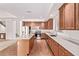 Spacious kitchen featuring a center island, stainless appliances, and tile floor at 42735 W Bravo Dr, Maricopa, AZ 85138