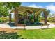 Large, covered playground featuring stone support pillars, a variety of climbing structures and benches at 42735 W Bravo Dr, Maricopa, AZ 85138