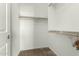 Walk-in closet featuring multiple shelves for organized storage at 42735 W Bravo Dr, Maricopa, AZ 85138