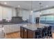 Bright kitchen featuring a center island, stainless steel appliances, and ample cabinet space at 4306 E Flower St, Phoenix, AZ 85018