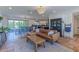 Stylish living room with wood floors, an open floor plan, and seamless transition to dining at 4306 E Flower St, Phoenix, AZ 85018