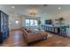 Comfortable living room featuring wood floors, stylish furnishings, and abundant natural light at 4306 E Flower St, Phoenix, AZ 85018
