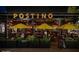 Inviting restaurant exterior with stylish umbrellas, lush planters, and open-air seating, perfect for dining at 4306 E Flower St, Phoenix, AZ 85018