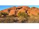 Unique rock formation featuring natural arch, showcasing scenic desert landscape, and the rough textures of sandstone at 4306 E Flower St, Phoenix, AZ 85018
