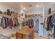 Spacious walk-in closet with organized storage solutions for clothing, shoes, and accessories at 4306 E Flower St, Phoenix, AZ 85018