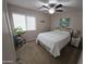 Guest bedroom featuring carpet, a ceiling fan, and a bright window at 43486 W Mccord Dr, Maricopa, AZ 85138