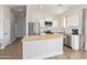 Bright kitchen featuring butcher block counters, stainless appliances, and white cabinetry at 43894 W Reitz Ranch Rd, Maricopa, AZ 85138