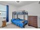 Bright bedroom featuring a bunk bed, dresser, and natural light from the window, creating a cozy space at 4507 E Warlander Ln, San Tan Valley, AZ 85140