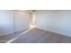 Bright bedroom featuring neutral carpet, a closet, and an open closet for storage at 4731 N 26Th Ln, Phoenix, AZ 85017