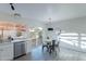 Dining area includes a modern light fixture, backyard views, and counter seating at 4731 N 26Th Ln, Phoenix, AZ 85017