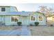 Charming exterior with light green siding, manicured bushes, and tidy landscaping at 4731 N 26Th Ln, Phoenix, AZ 85017