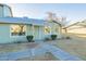 Charming exterior with light green siding, manicured bushes, and tidy landscaping at 4731 N 26Th Ln, Phoenix, AZ 85017