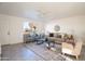 Bright living room featuring a large window, comfortable seating, and modern decor at 4731 N 26Th Ln, Phoenix, AZ 85017
