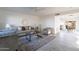 Bright living room features neutral walls, ceiling fan, and gray tile flooring and decor at 4731 N 26Th Ln, Phoenix, AZ 85017