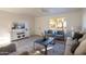 Bright living room featuring a large window, comfortable seating, and modern decor at 4731 N 26Th Ln, Phoenix, AZ 85017