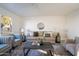 Bright living room with comfortable seating, decor, and a large window at 4731 N 26Th Ln, Phoenix, AZ 85017