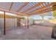 Spacious brick patio area with a wooden pergola, perfect for outdoor gatherings and relaxation at 4731 N 26Th Ln, Phoenix, AZ 85017