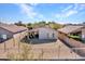 View of the home's backyard with desert landscaping, covered patio, and fenced-in yard at 4744 E Laredo Ln, Cave Creek, AZ 85331