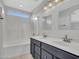 Modern bathroom features a double sink vanity, and a combined shower and tub at 4744 E Laredo Ln, Cave Creek, AZ 85331