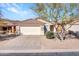 Charming single-story home featuring a well-maintained front yard, desert landscaping and a two-car garage at 4744 E Laredo Ln, Cave Creek, AZ 85331