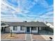 Aerial shot of a cute single-story house with a covered car port, desert landscaping and gray tiled walkway at 4848 N 81St Dr, Phoenix, AZ 85033