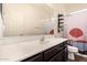 Modern bathroom vanity with a sink, large mirror, and artistic shower curtain at 5345 W Leodra Ln, Laveen, AZ 85339