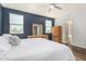 A bedroom with a bed, dresser with mirror and ensuite bathroom at 5345 W Leodra Ln, Laveen, AZ 85339