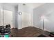 Bedroom featuring an organized home gym setup and a closet with sliding doors at 5345 W Leodra Ln, Laveen, AZ 85339