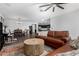 Open-concept living area connecting a stylish living room to the dining area and modern kitchen at 5345 W Leodra Ln, Laveen, AZ 85339
